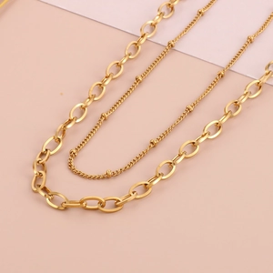 Gold stainless steel double layer necklace with thick oval links and delicate beaded chain