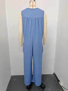 Detailed back view of a blue sleeveless ribbed knit romper with ruched details