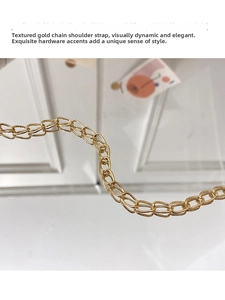 Macro shot of polished gold alloy chain links with glossy metallic finish and reflection