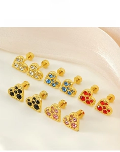 Close-up of heart-shaped titanium steel earrings with colorful rhinestones in gold finish