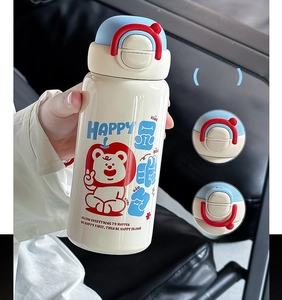 Detail of safety lock mechanism on cream insulated bottle with cute bear illustration
