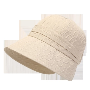 Detail of beige sun hat featuring unique wrinkled texture and durable wavy fabric