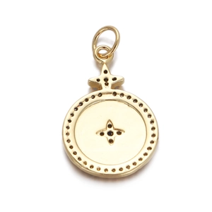 Close-up of golden star pendant with colorful crystals and polished metal finish