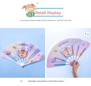 Detail of a purple foldable fan with a cartoon astronaut girl and star patterns