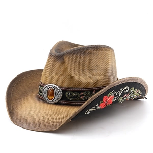 Straw cowboy hat with flower embroidery and vintage buckle on a clean white background