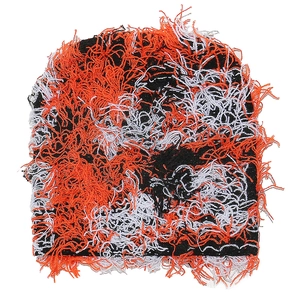 Detail of distressed orange knit beanie with frayed edges and street style design
