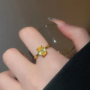 Three-layer golden snake ring with oval yellow gemstone and textured band for women