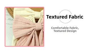 Detail showing the textured checkered fabric of cream and pink handmade bow hair clips