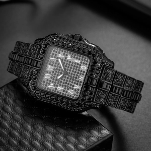 Detail of luxury black square watch featuring full iced-out crystals and Arabic numerals