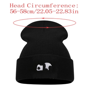 Close-up of black panda knit beanie showing 56-58cm head circumference measurement