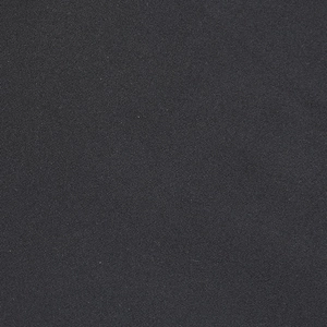 Detailed macro view of the premium black twill fabric texture and fine weaving craftsmanship