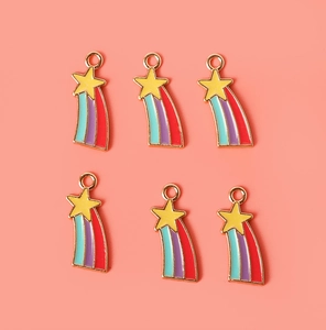Detailed view of six colorful enamel rainbow star charms for DIY jewelry making