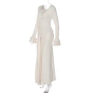 Detail of V-neck lace trim and ruffled sleeves on beige slim fit long dress