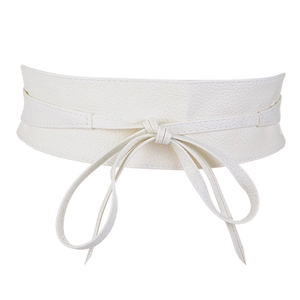 Close-up of white faux leather wide waist belt featuring a front bow tie knot detail