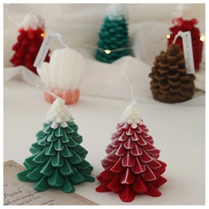 Close-up of Christmas tree shaped scented candles with clear wax texture and festive colors