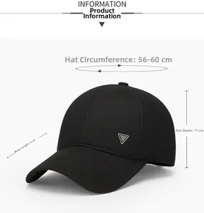 Detail of black wool baseball cap featuring silver triangle metal badge and fabric texture