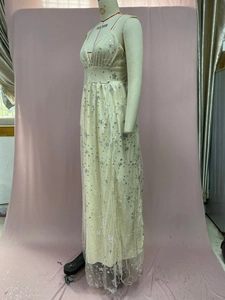Detail of silver star sequins on off-white mesh maxi dress with delicate straps