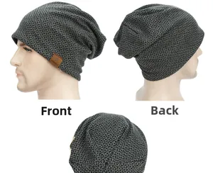 Macro view of checkered knit beanie with a brown leather logo patch on dark grey texture