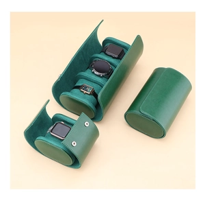 Detail of dark green leather watch travel cases in single and triple slot variations