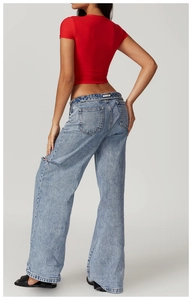 Detailed back view of a slim fit red cropped sports T-shirt with blue wide-leg jeans