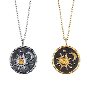 Bohemian sun and moon pendant necklace set with yellow gemstones in silver and gold