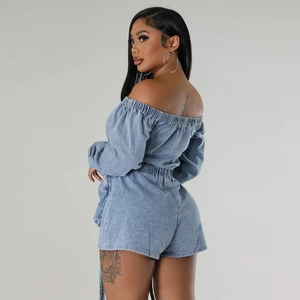 Detail view of light blue denim tube top and high waist shorts set from the back