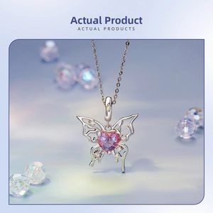 Close-up of S925 silver hollow butterfly necklace with pink heart-shaped gemstone