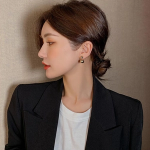 Minimalist double gold ball earrings for women featuring a sleek geometric design