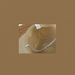 Detail of internal lining and adjustable band for a French style wide brim paper straw hat