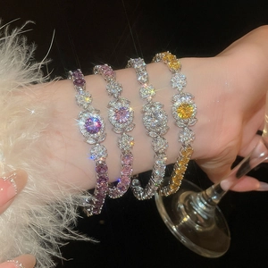 Close-up of four luxury zircon tennis bracelets in purple pink yellow and white colors