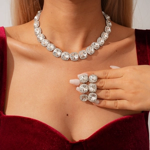 Close-up of sparkling cubic zirconia jewelry set with necklace and earrings on model