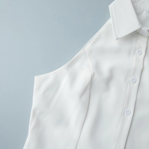 Detail of white sleeveless shirt collar and button-down placket in premium fabric