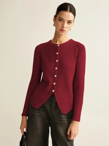 Detail of wine red ribbed knit cardigan with golden ball buttons and curved hem