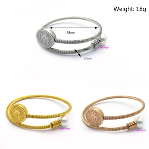 Detailed specs of adjustable wire bangles with St. Benedict medal and shell pearl