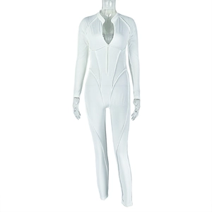 Detail of white long-sleeve catsuit showing front zipper and refined stitching on mannequin
