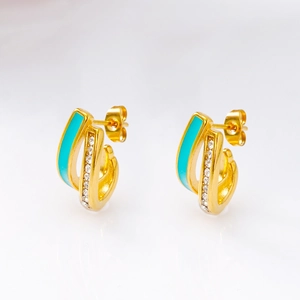 Detail view of 18K gold plated C-shaped earrings with blue enamel and white zircon stones