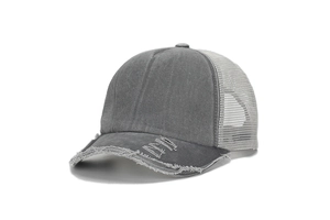 Detailed side view of distressed grey trucker hat with breathable mesh and frayed edges