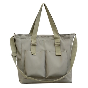 Waterproof grey-green nylon tote bag with adjustable shoulder strap and large front pockets