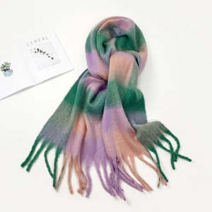 Detail of colorful plaid scarf with green and purple gradient stripes and soft fringes