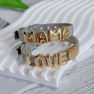 Detail of adjustable silver mesh bracelets with gold MAMA and LOVE letter charms