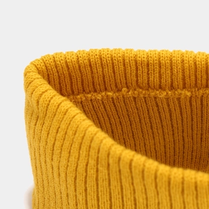 Detailed close-up of the mustard yellow rib-knit fabric texture for fitness headbands