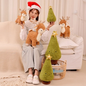 Cute green plush Christmas tree pillow and brown reindeer toy with gold star and bell