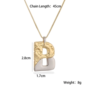 Detailed view of two-tone letter B pendant with size specs 45cm chain and 8g weight