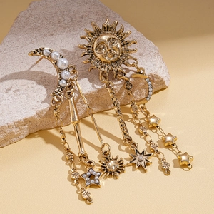 Asymmetric vintage gold earrings with sun, moon, and star fringe featuring faux pearls