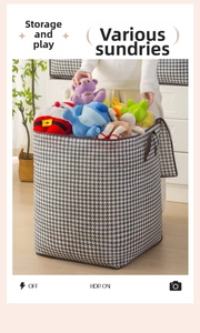 Detail of houndstooth storage bag with side handle containing large plush toys