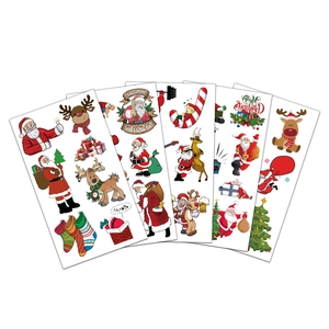 Set of five colorful Christmas cartoon tattoo stickers featuring Santa and reindeer motifs
