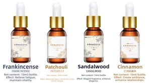 Set of four 10ml essential oil bottles with droppers including sandalwood and cinnamon