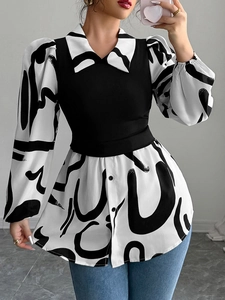 Detail of elegant black and white patchwork shirt with abstract print and puff sleeves