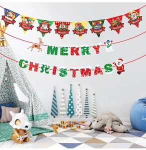 Detail of Christmas banner set with Merry Christmas lettering in a cozy kids room