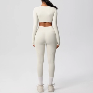 Back view of cream high-waisted yoga leggings and long-sleeve crop top set